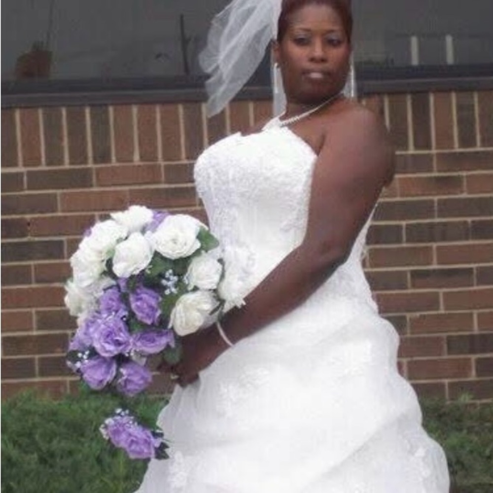 Elegant White Wedding Dress with Purple and White Bouquet